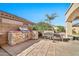 Outdoor kitchen with grill and built-in cabinets at 6782 W Firebird Dr, Glendale, AZ 85308