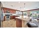 Spacious kitchen with stainless steel appliances and an island at 6782 W Firebird Dr, Glendale, AZ 85308
