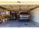 Two-car garage with golf cart and extra storage at 10637 W Welk Dr, Sun City, AZ 85373