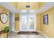 Interior view of entryway with double doors and tiled floor at 10637 W Welk Dr, Sun City, AZ 85373