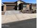 Single-story home with attached garage and desert landscaping at 23461 N 76Th Pl, Scottsdale, AZ 85255