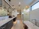 Luxurious bathroom boasting a soaking tub, walk-in shower, and and sinks at 37200 N Cave Creek Rd # 1002, Scottsdale, AZ 85262