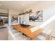 Spacious dining area with modern light fixture and large artwork at 37200 N Cave Creek Rd # 1002, Scottsdale, AZ 85262