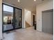 Bright entryway with elevator and staircase at 37200 N Cave Creek Rd # 1002, Scottsdale, AZ 85262