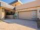 Three-car garage with modern door and paver driveway at 37200 N Cave Creek Rd # 1002, Scottsdale, AZ 85262