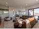 Spacious living room with sectional sofa, large windows, and mountain views at 37200 N Cave Creek Rd # 1002, Scottsdale, AZ 85262