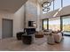 Open living area with a stone fireplace and access to a backyard patio at 37200 N Cave Creek Rd # 1002, Scottsdale, AZ 85262