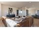Open living area with sectional sofa, ample seating, and light-filled space at 37200 N Cave Creek Rd # 1002, Scottsdale, AZ 85262