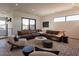 Relaxing living room with sectional sofa, plush seating, and large windows at 37200 N Cave Creek Rd # 1002, Scottsdale, AZ 85262