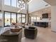 Spacious living room with open kitchen and large windows at 37200 N Cave Creek Rd # 1002, Scottsdale, AZ 85262