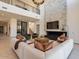 Two-story living room with fireplace and high ceilings at 37200 N Cave Creek Rd # 1002, Scottsdale, AZ 85262