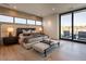 Main bedroom with plush bed and access to patio at 37200 N Cave Creek Rd # 1002, Scottsdale, AZ 85262