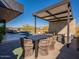 Relaxing pool area with patio furniture and a pergola at 37200 N Cave Creek Rd # 1002, Scottsdale, AZ 85262