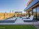 Modern pool and spa area with lounge chairs and a pergola at 37200 N Cave Creek Rd # 1002, Scottsdale, AZ 85262