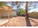 Large backyard with mature trees and a covered patio area at 234 N Heritage Dr, Gilbert, AZ 85234