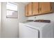 Laundry room with washer, dryer, and cabinets at 234 N Heritage Dr, Gilbert, AZ 85234