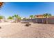 Large backyard oasis with a trampoline, fire pit, and plenty of space at 18525 N Madison Rd, Maricopa, AZ 85139