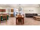 Kitchen and dining area with a rustic wooden table at 18525 N Madison Rd, Maricopa, AZ 85139