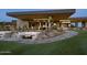 Relaxing outdoor patio area with fire pit and scenic mountain views at 37200 N Cave Creek Rd # 1002, Scottsdale, AZ 85262