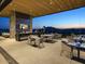 Elegant outdoor dining space with mountain views and modern seating at 37200 N Cave Creek Rd # 1002, Scottsdale, AZ 85262