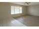 Living room with tile and wood flooring and ceiling fan at 16025 N Nicklaus Ln, Sun City, AZ 85351