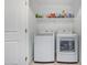 Laundry room with washer, dryer, and shelving at 2150 W Alameda Rd # 1327, Phoenix, AZ 85085