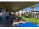 Relaxing patio area with seating and ping pong table near pool at 9645 E Theia Dr, Mesa, AZ 85212