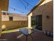 Private backyard with patio, string lights, and grass at 9645 E Theia Dr, Mesa, AZ 85212