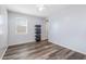 Bright bedroom with wood-look floors and ceiling fan at 9645 E Theia Dr, Mesa, AZ 85212