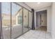 View of backyard access through sliding glass doors, showing a patio and exterior at 9645 E Theia Dr, Mesa, AZ 85212