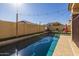 Relaxing backyard pool with string lights and lounge chairs at 9645 E Theia Dr, Mesa, AZ 85212