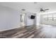 Spacious bedroom with wood-look floors and en-suite bathroom at 9645 E Theia Dr, Mesa, AZ 85212