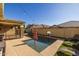 Relaxing backyard oasis with a sparkling pool and lounge chairs at 9645 E Theia Dr, Mesa, AZ 85212