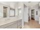 Bathroom with double vanity and access to walk-in closet at 9645 E Theia Dr, Mesa, AZ 85212