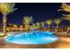 Enjoy resort-style living with this community pool, featuring palm trees and a hot tub at 9645 E Theia Dr, Mesa, AZ 85212