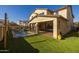 View of the house's exterior and the pool area with a patio at 9645 E Theia Dr, Mesa, AZ 85212