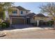 Two-story house with a large garage and well-manicured landscaping at 9645 E Theia Dr, Mesa, AZ 85212