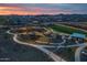 Aerial view of a community featuring a playground, park, and residential homes at 9645 E Theia Dr, Mesa, AZ 85212