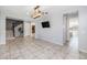 Open dining area with wood chandelier and view of kitchen at 9645 E Theia Dr, Mesa, AZ 85212