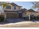 Two-story house with a large garage and well-manicured landscaping at 9645 E Theia Dr, Mesa, AZ 85212