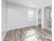 Bright bedroom with wood-look floors and spacious closet at 9645 E Theia Dr, Mesa, AZ 85212