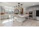 Spacious kitchen featuring an island, stainless steel appliances, and pendant lighting at 9645 E Theia Dr, Mesa, AZ 85212