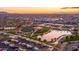 Aerial view of a vibrant community with a park, pond, and food trucks at 9645 E Theia Dr, Mesa, AZ 85212