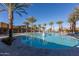 Resort-style pool with lounge chairs and palm trees at 9645 E Theia Dr, Mesa, AZ 85212