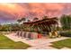 Relaxing community space with shaded seating and water features at 9645 E Theia Dr, Mesa, AZ 85212