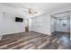 Main bedroom with wood-look floors and ensuite bathroom at 9645 E Theia Dr, Mesa, AZ 85212