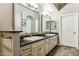 Elegant bathroom with double sinks, granite countertops, and large mirrors at 7601 E Indian Bend Rd # 3002, Scottsdale, AZ 85250