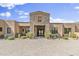 Luxury home with a striking stone facade and double front doors at 27225 N 71St Pl, Scottsdale, AZ 85266