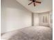 Spacious carpeted bedroom with large windows and ceiling fan at 5230 E Brown Rd # 260, Mesa, AZ 85205