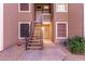 Condo building entry with stairs and landscaping at 5230 E Brown Rd # 260, Mesa, AZ 85205